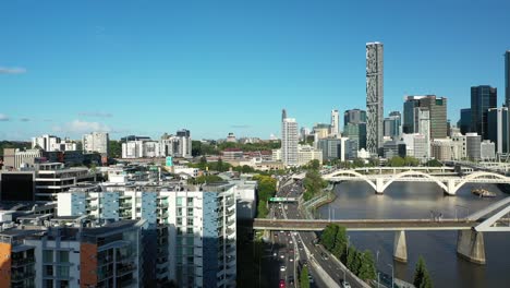 impressive drone shot of office building in milton, capturing a stunning view of the brisbane river and cityscape