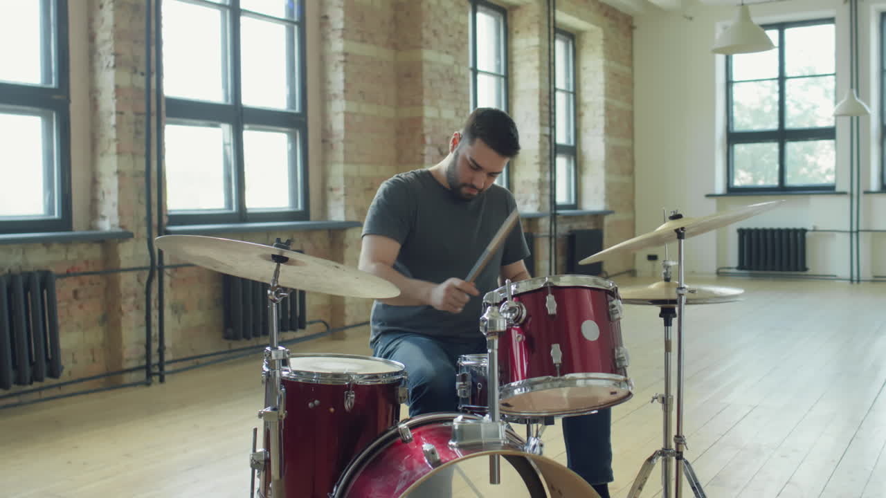 Drummer Playing Drums in Music Rehearsal Studio