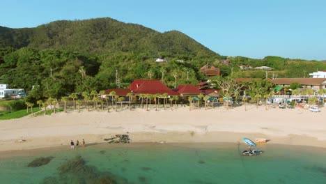 Idyllic-tropical-white-sand-beach-and-palms-of-Amami-Island