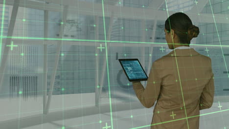 animation of data processing over businesswoman using tablet