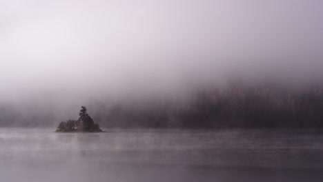 foggy dramatic scene looking across swan lake in montana