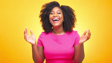happy woman with curly hair smiling in pink dress