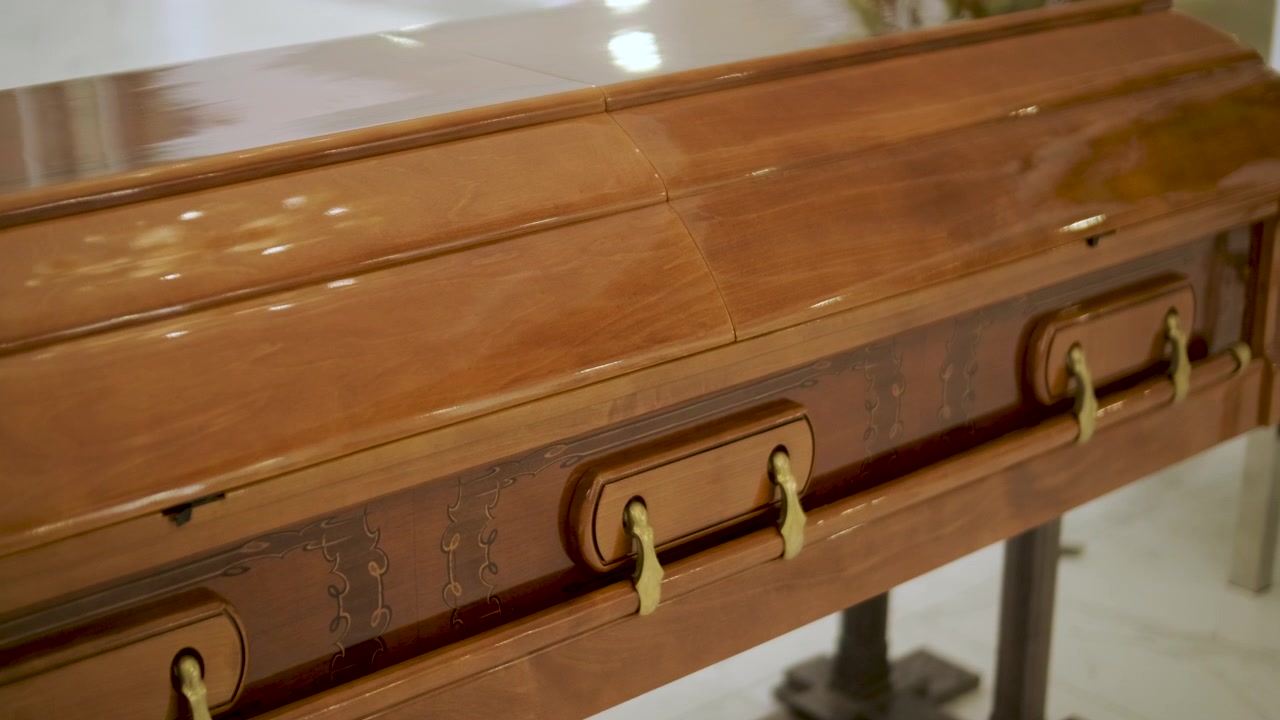 Polished Wooden Casket on Display in Funeral Home