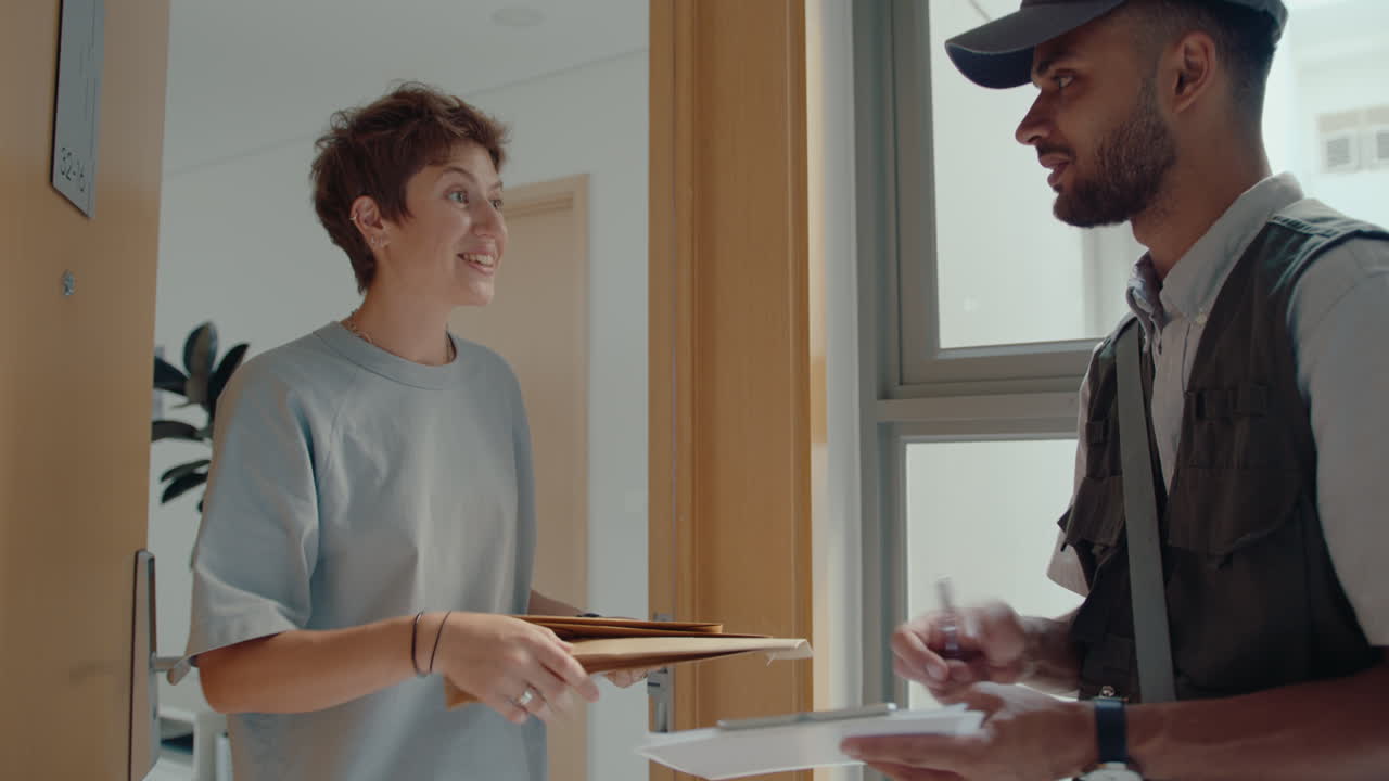 Young Woman Receiving Express Mail from Courier