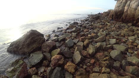 Waves-hit-a-rocky-beach-at-the-Blue-Lagoon-in-Port-Dickson,-Malaysia