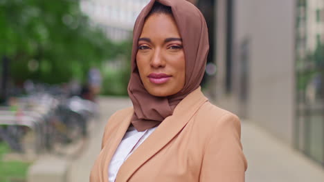 Portrait-Of-Modern-Muslim-Businesswoman-Wearing-Hijab-With-Business-Suit-Going-To-Work-Standing-Outside-Office-Buildings