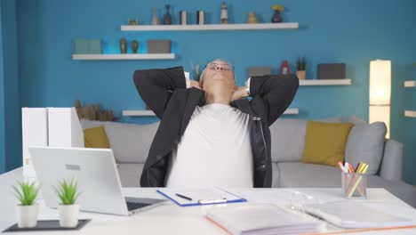 home office worker man completes his work and relax.