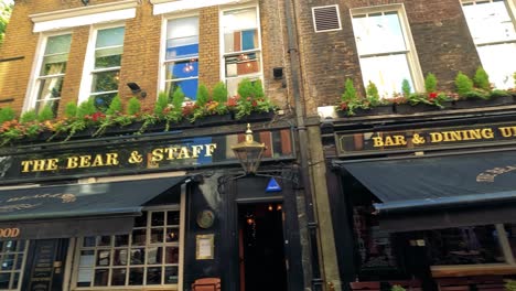 charming pub facade with vibrant greenery