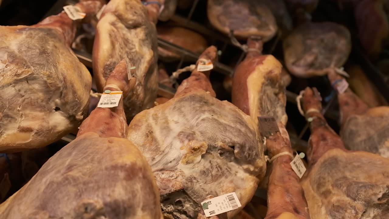 Jamon serrano pig legs factory hanging in a industry. Iberian ham elaboration process