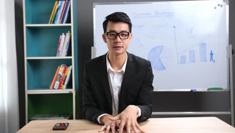 asian businessman talking about business plan