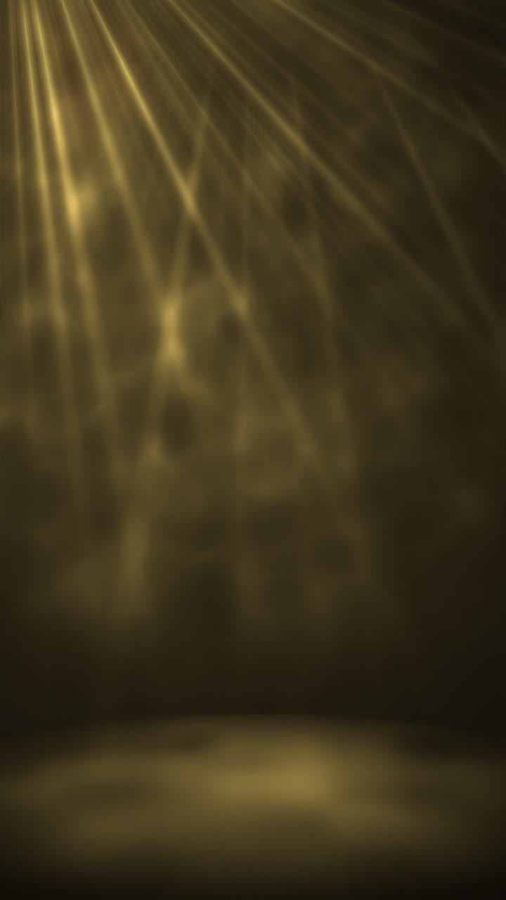 Golden Spotlight Rays Shimmering on Dark Background