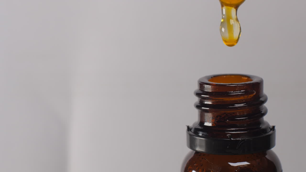 Amber Bottle of Essential Oil with Dropper