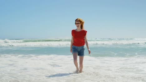 Woman-having-a--fun-on-beach-4k