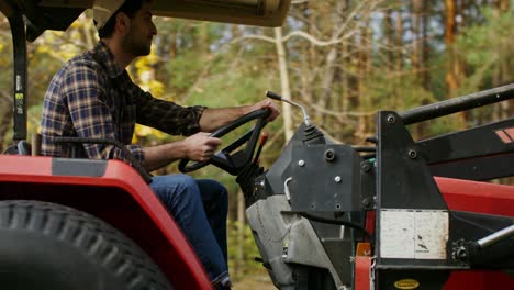 farmer driving a tractor in a field