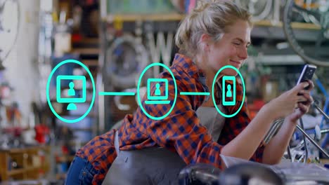 Animation-of-network-of-digital-icons-over-caucasian-female-mechanic-using-smartphone-at-a-garage