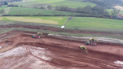 parallax drone footage of construction vehicles at work