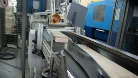 parquet moving in a special device. production line in woodworking factory