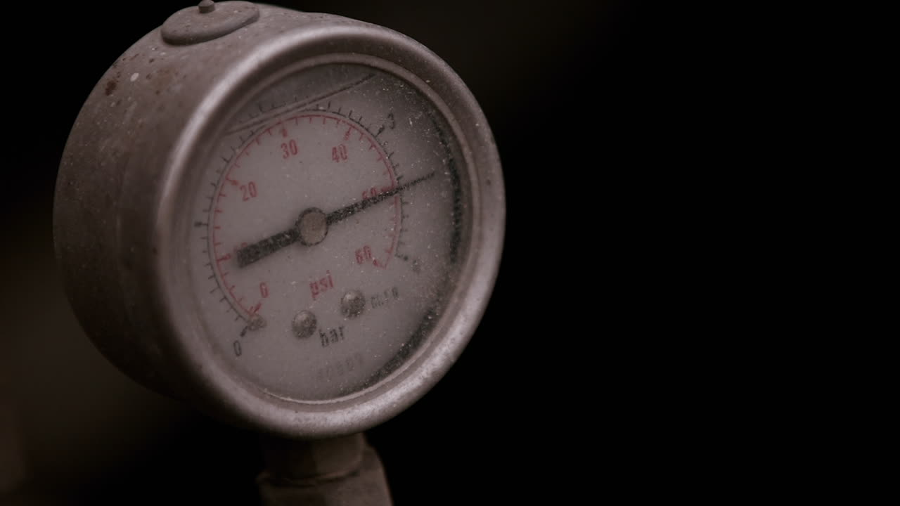 Close Up of Vintage Pressure Gauge with Moving Needle