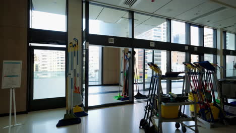 office building cleaning supplies and city view