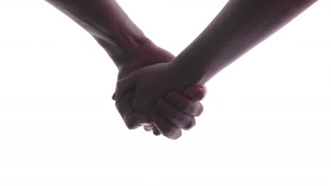 close-up of a woman and a man holding hand in hand