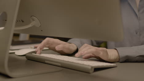 Close-Up-Of-Employee-Woman-Hands-Typing-On-Computer-Keyboard-At-Workplace