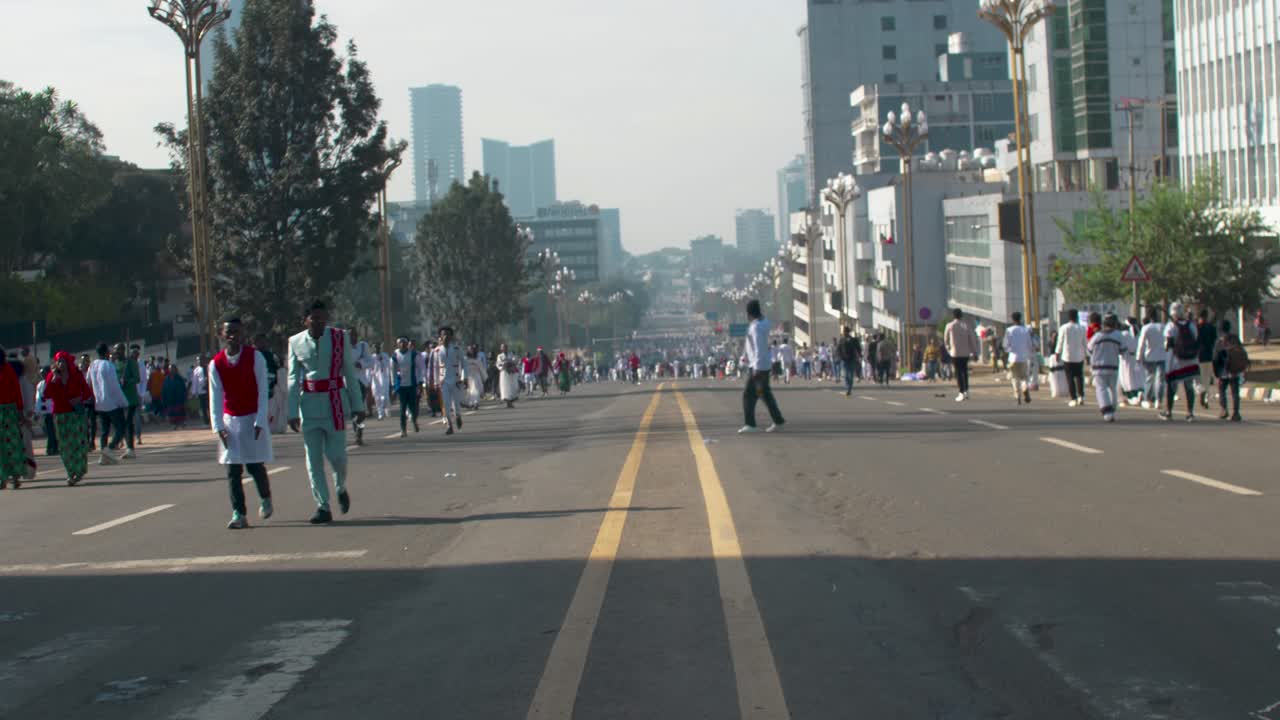 Empty Car road in Ethiopia Addis Ababa for Irreecha 2024 Celebration with people walking with Traditional clothes