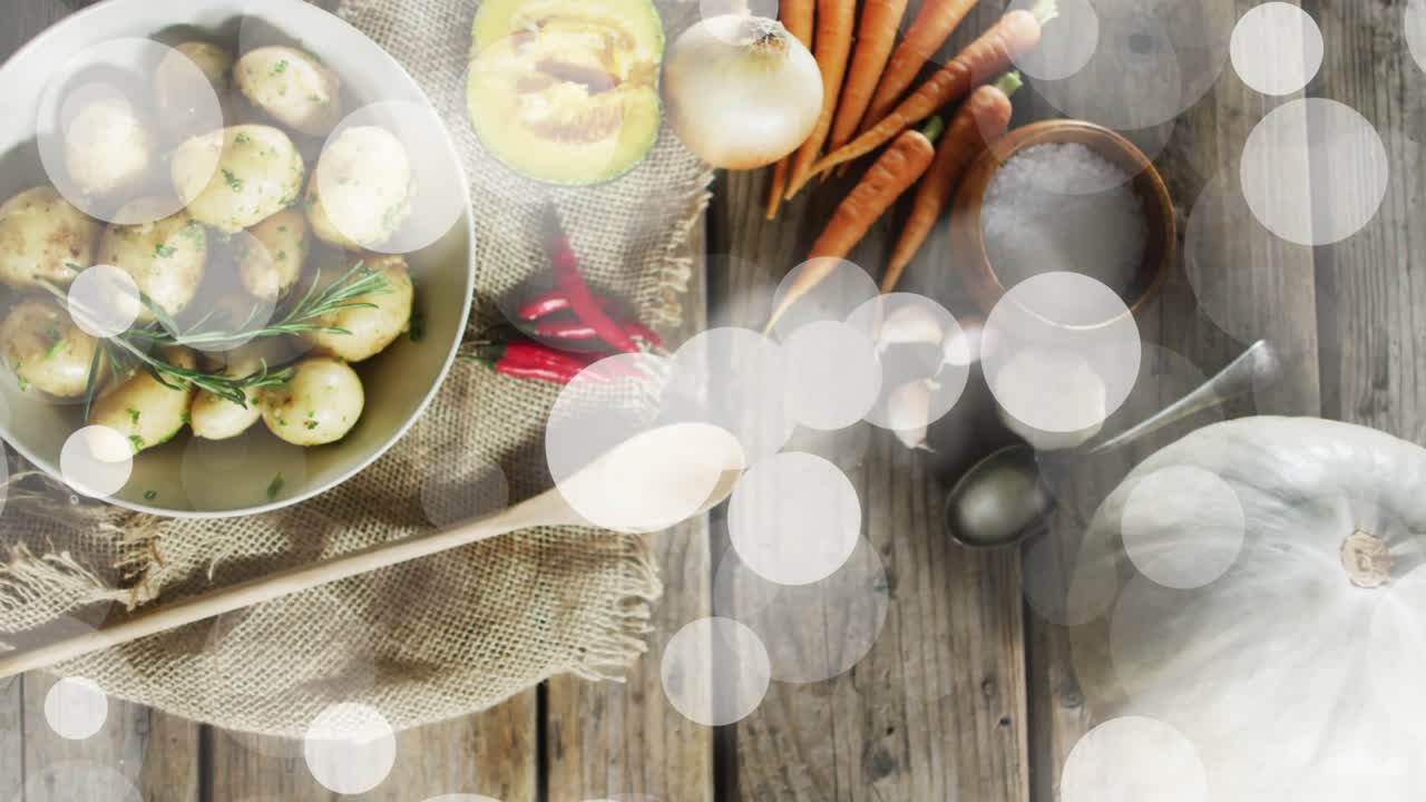 On start circular flares fading in and drifting over rustic ingredients adding gentle bokeh overlay