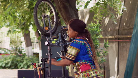 Woman-fine-tuning-bicycle-tire-with-tool