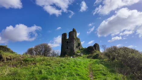 Castle-ruins-on-the-hill,historic-site-Dunhill-Castle-Waterford-Ireland-historic-past-and-now-a-tourist-attraction-in-rural-idyllic-landscape