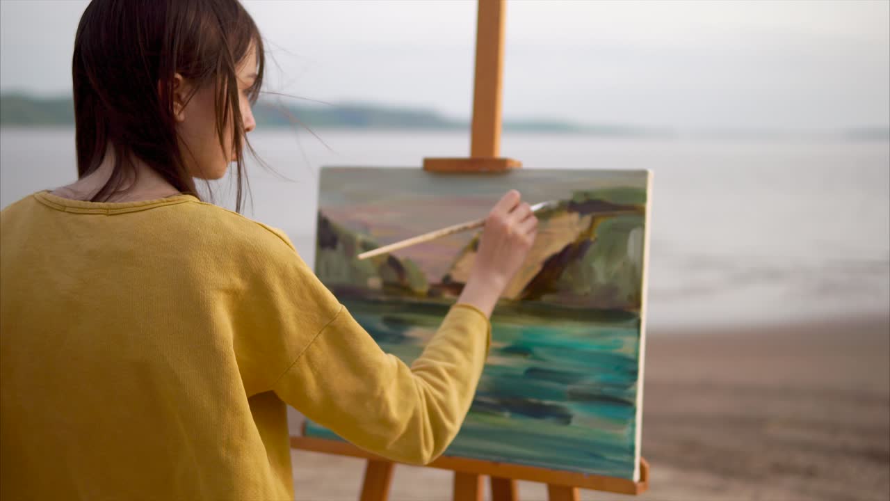 Woman Painting Landscape on the Beach
