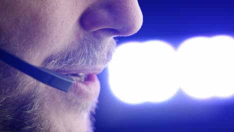 full frame close-up: caucasian male telephone operator talking, colors