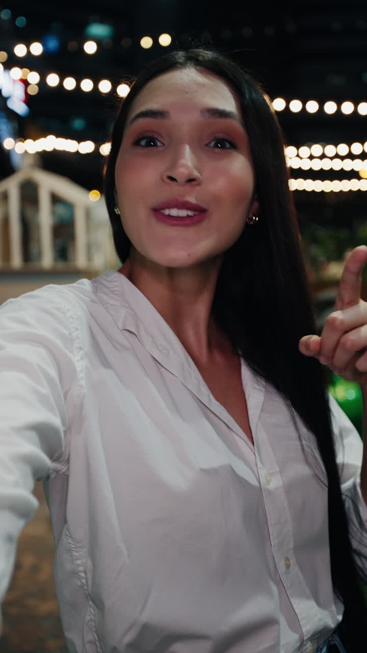 Happy Woman Taking Selfie at Night
