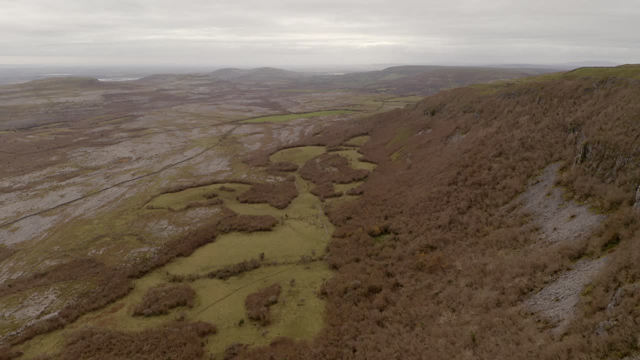 Burren National Park's Rocky Mountain and grasslands in a cinematic aerial tracking view