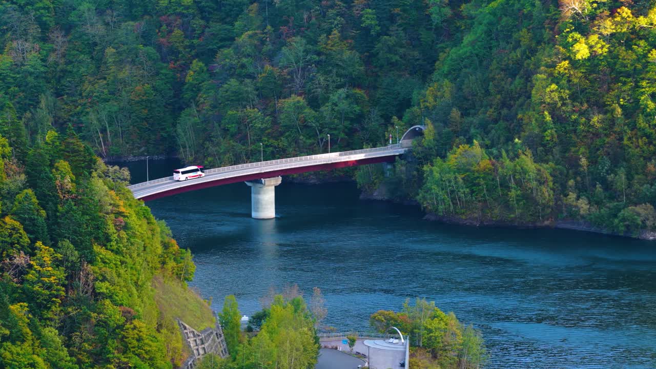 Autumn in Japan, Bus Crossing Bridge over Jozankei Dam in Mountains of Sapporo