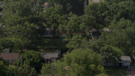 drone camera tilts down to reveal suburban neighborhood