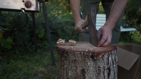 Herbalist-splitting-dried-mushroom-chunks-with-axe-to-prepare-for-dual-extracted-tincture