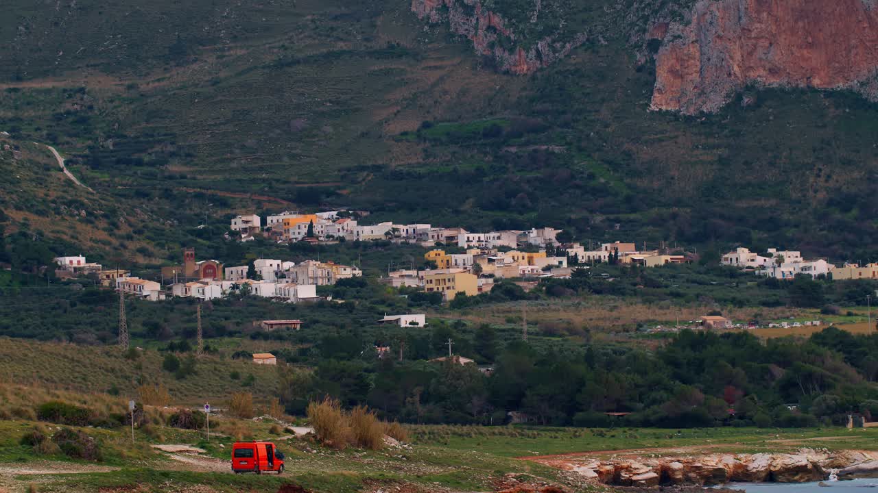 Coastal village in San Vito Lo Capo, Sicily, Italy, with mountains and greenery