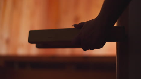 woman entering a sauna