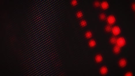abstract motion of red dots on a dark background