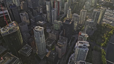 Vancouver-BC-Canada-Aerial-v52-bird's-eye-view-drone-flyover-Coal-harbour-capturing-downtown-cityscape-with-the-afternoon-sunlight-shining-on-the-skyscrapers---Shot-with-Mavic-3-Pro-Cine---July-2023