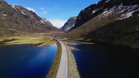 Van-journey-on-long-winding-road-in-spectacular-scenery