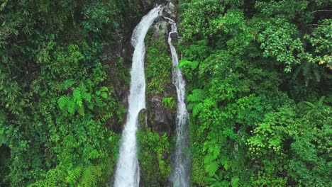 Aerial-view-of-falling-Ulan-Waterfall-in-tropical-landscape-on-Biliran-Island-at-sunny-day