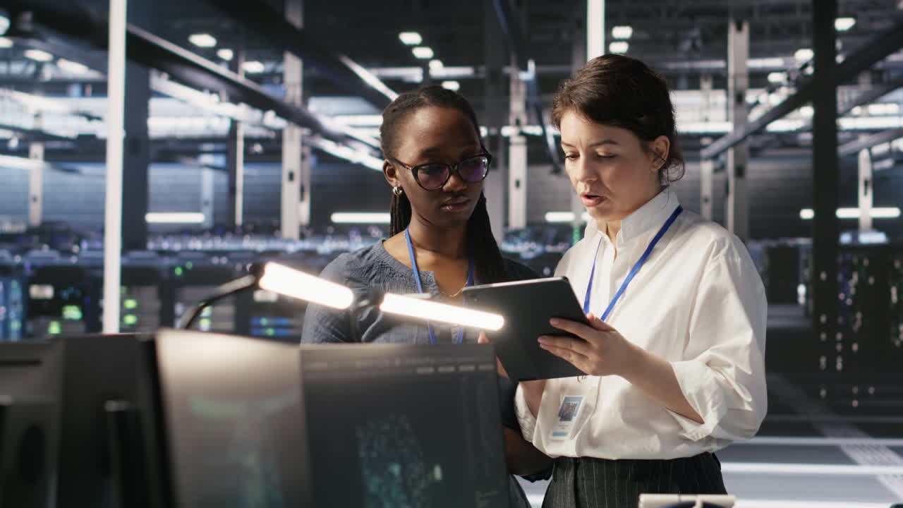 Vertical video Teamworking engineers in data center integrating AI automation tools