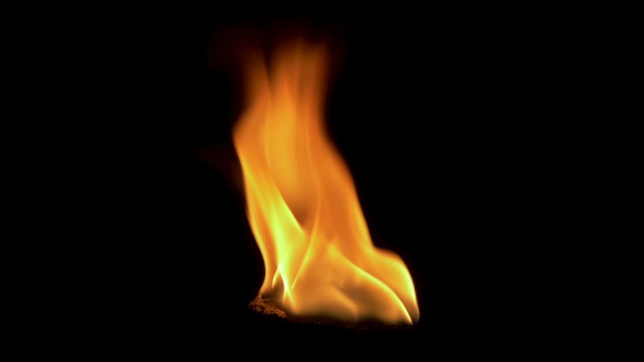 Close-Up Isolated Torch Against Darkness