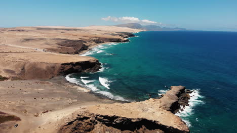 Aerial-drone-shot-of-the-La-Pared-beach-in-Fuerteventura-on-a-sunny-day