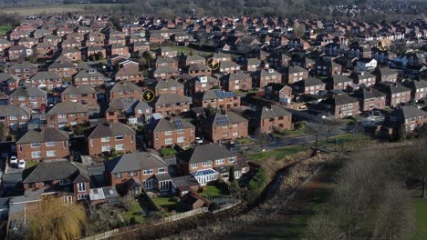 multiple energy icons flashing above aerial view residential british neighbourhood property concept