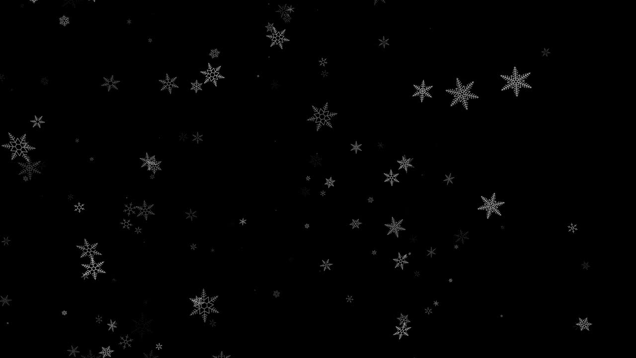 Snowflakes falling on black background.