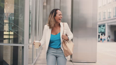 Beautiful-mixed-race-business-woman-walking-through-city