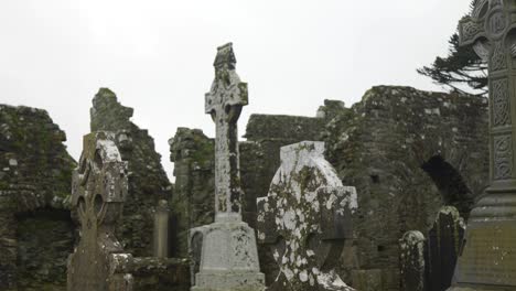 Ancient-Celtic-crosses-stand-amidst-the-ruins-of-a-medieval-church-in-County-Meath,-Ireland