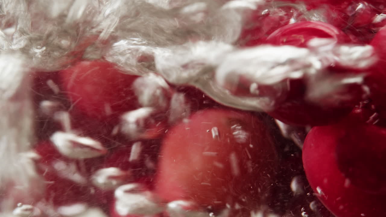 Frozen cranberries cooking for tea or jam, Background Close up of cranberry berries in on the kitchen, chef making dessert healthy pie.